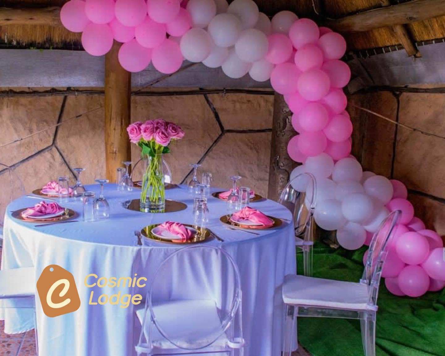 Pink balloon and floral private event table